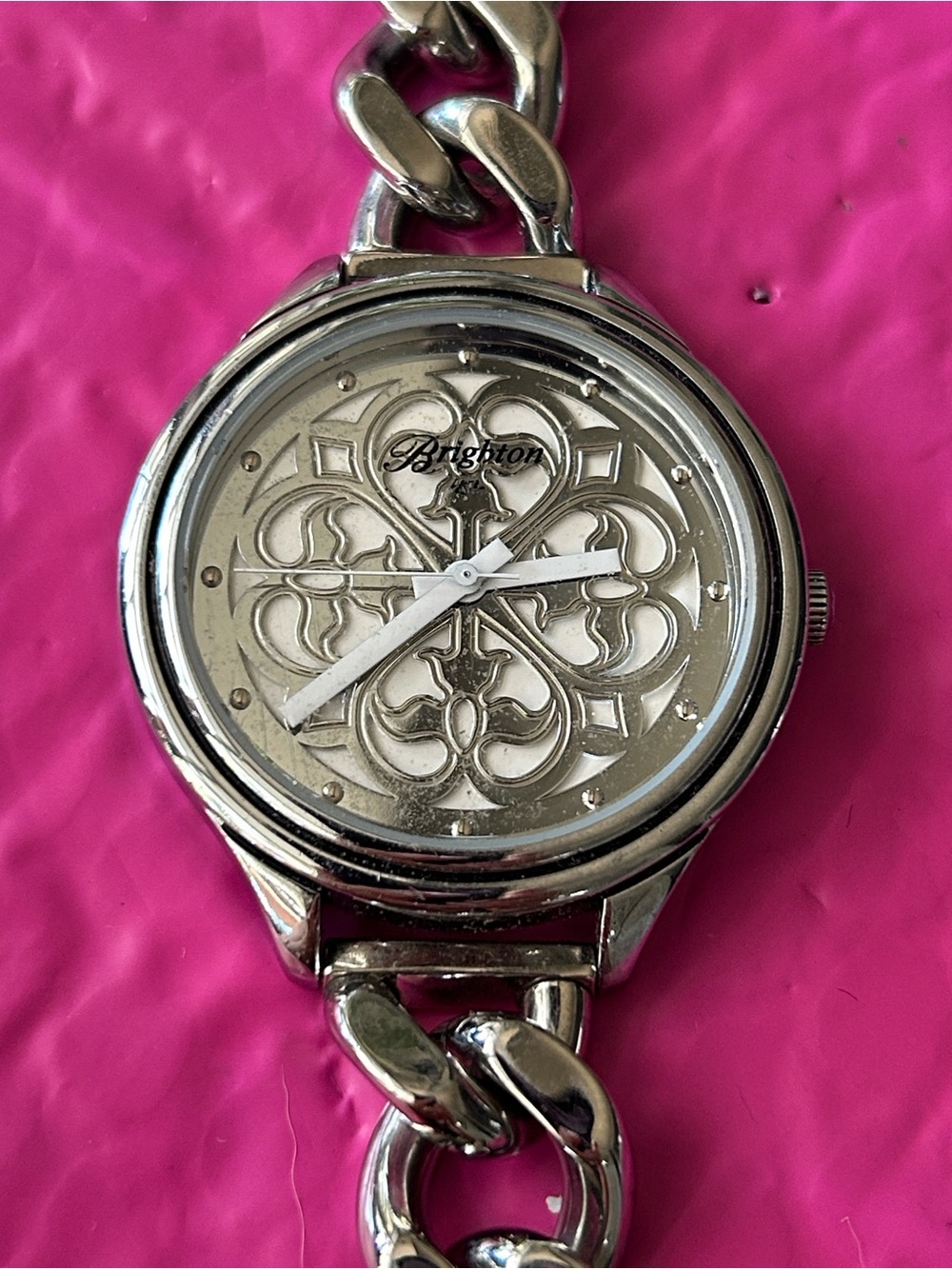 Brighton chain-link watch showcasing the ornate, scrollwork cut-out motif